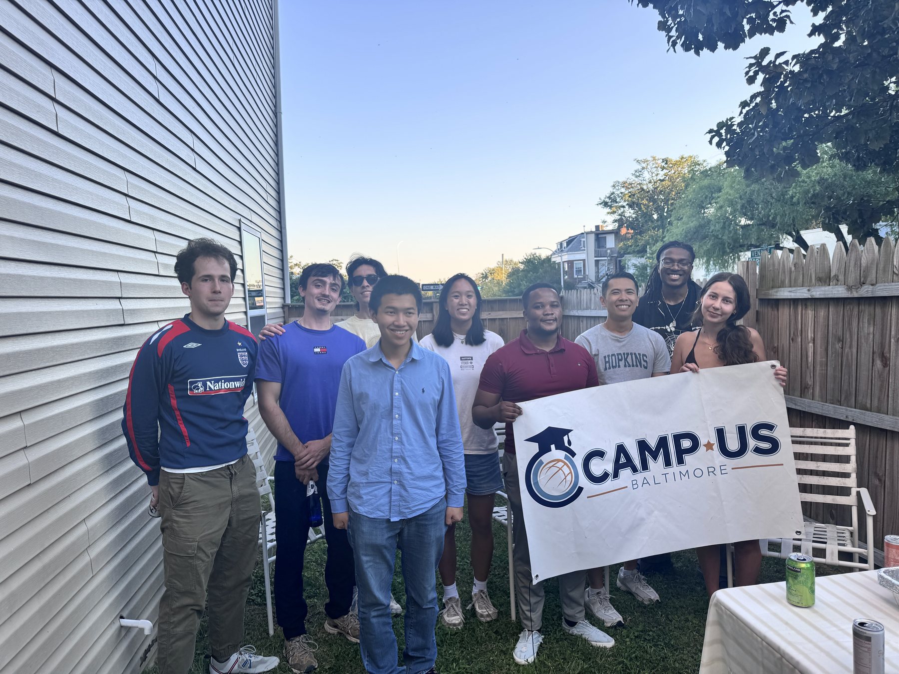CAMP-US residents together behind the CAMP-US Baltimore banner
